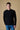 Black English rib sweater with distressed details