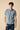 Garment-dyed polo shirt in marbled blue with contrasting embroidery