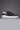 VEGA - White retro high black sole sneakers with studs and paint splashes