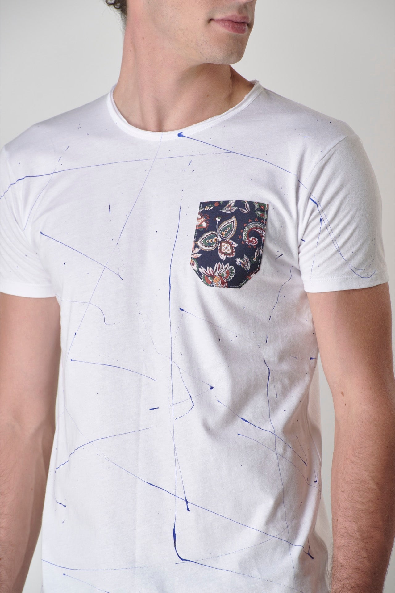 White T-Shirt with V2 fabric pocket and paint splatters
