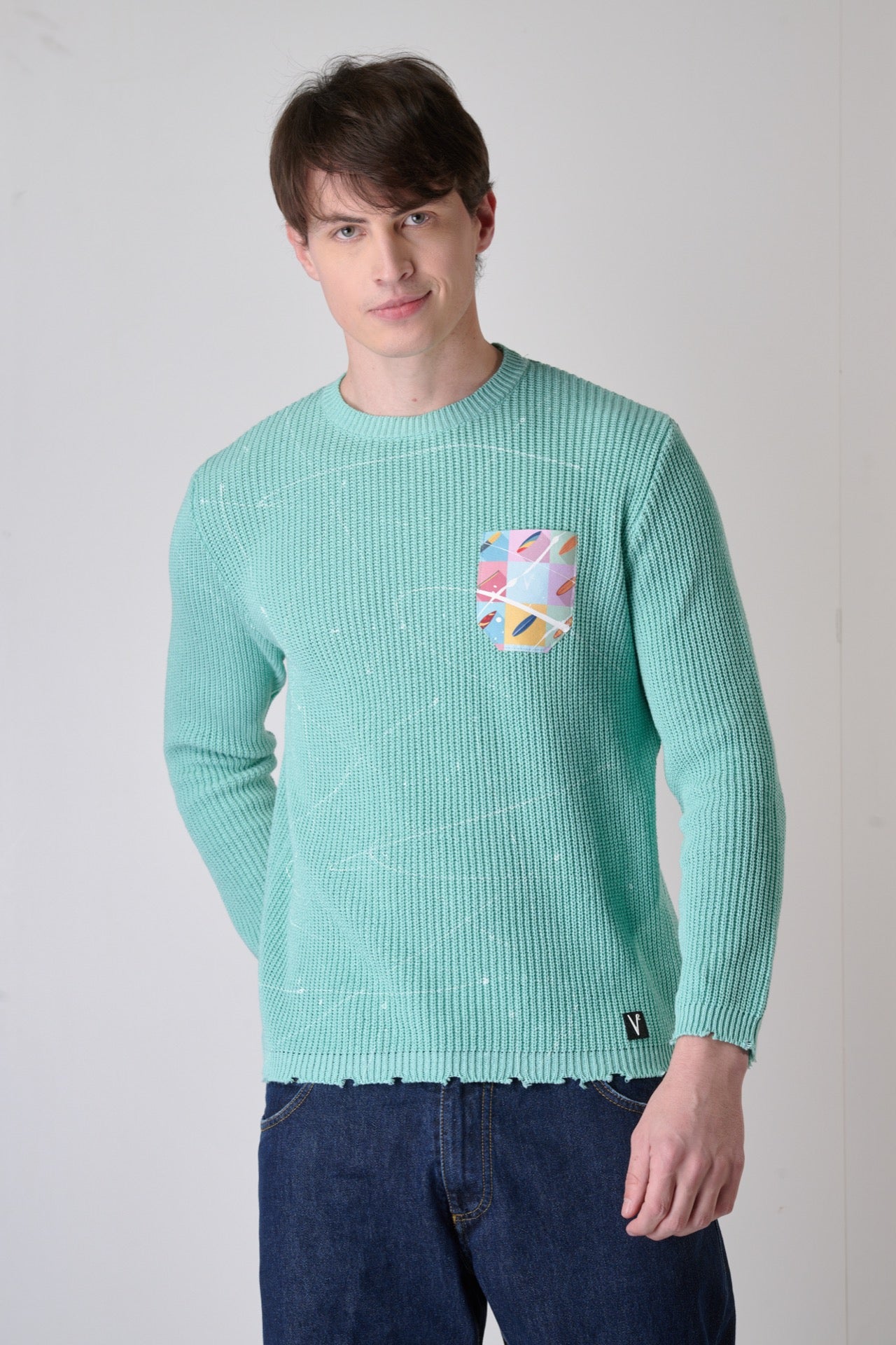 Mint Green crew neck sweater with paint splatter tears and V2 fabric pocket