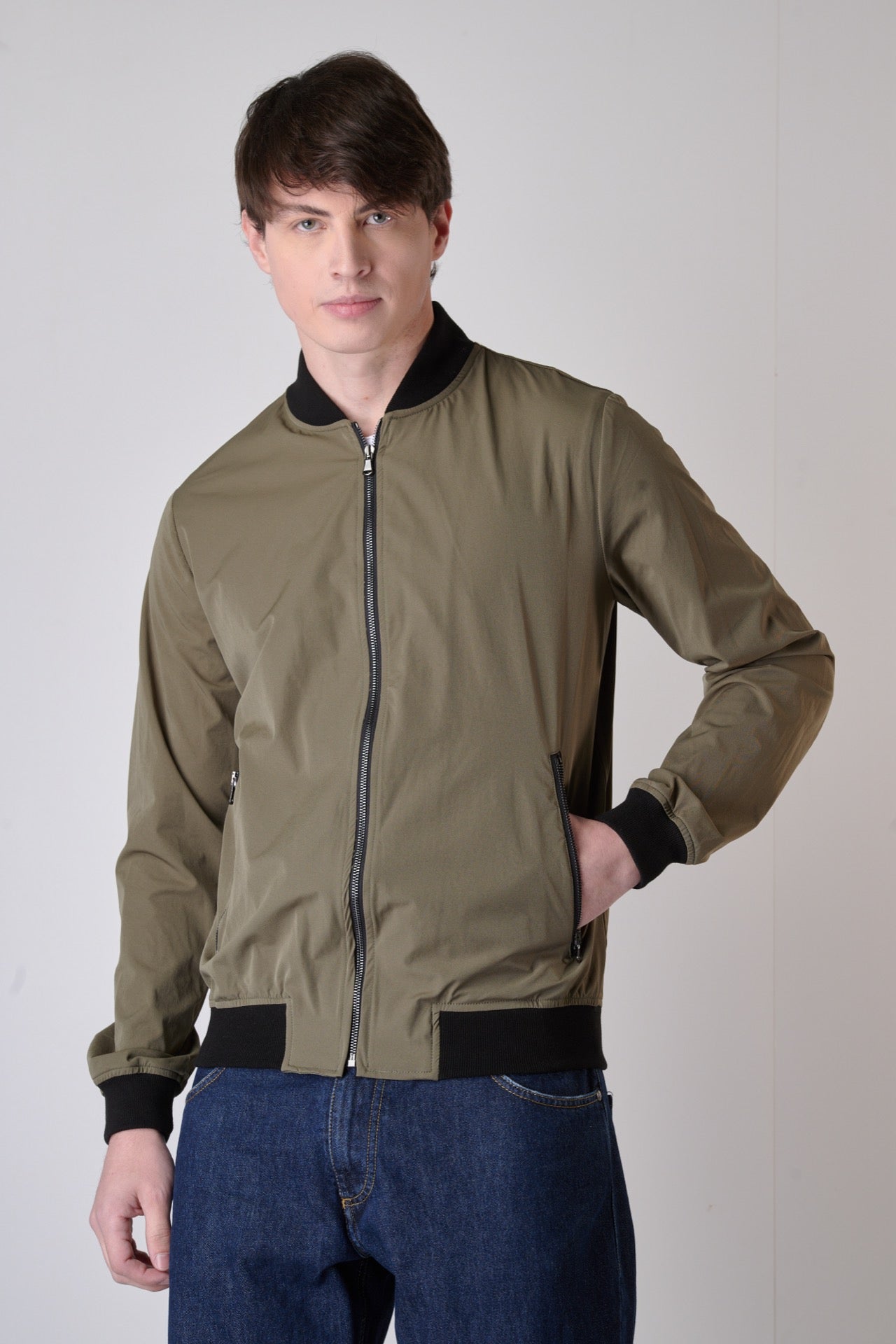 Technical fabric bomber jacket with military green zip
