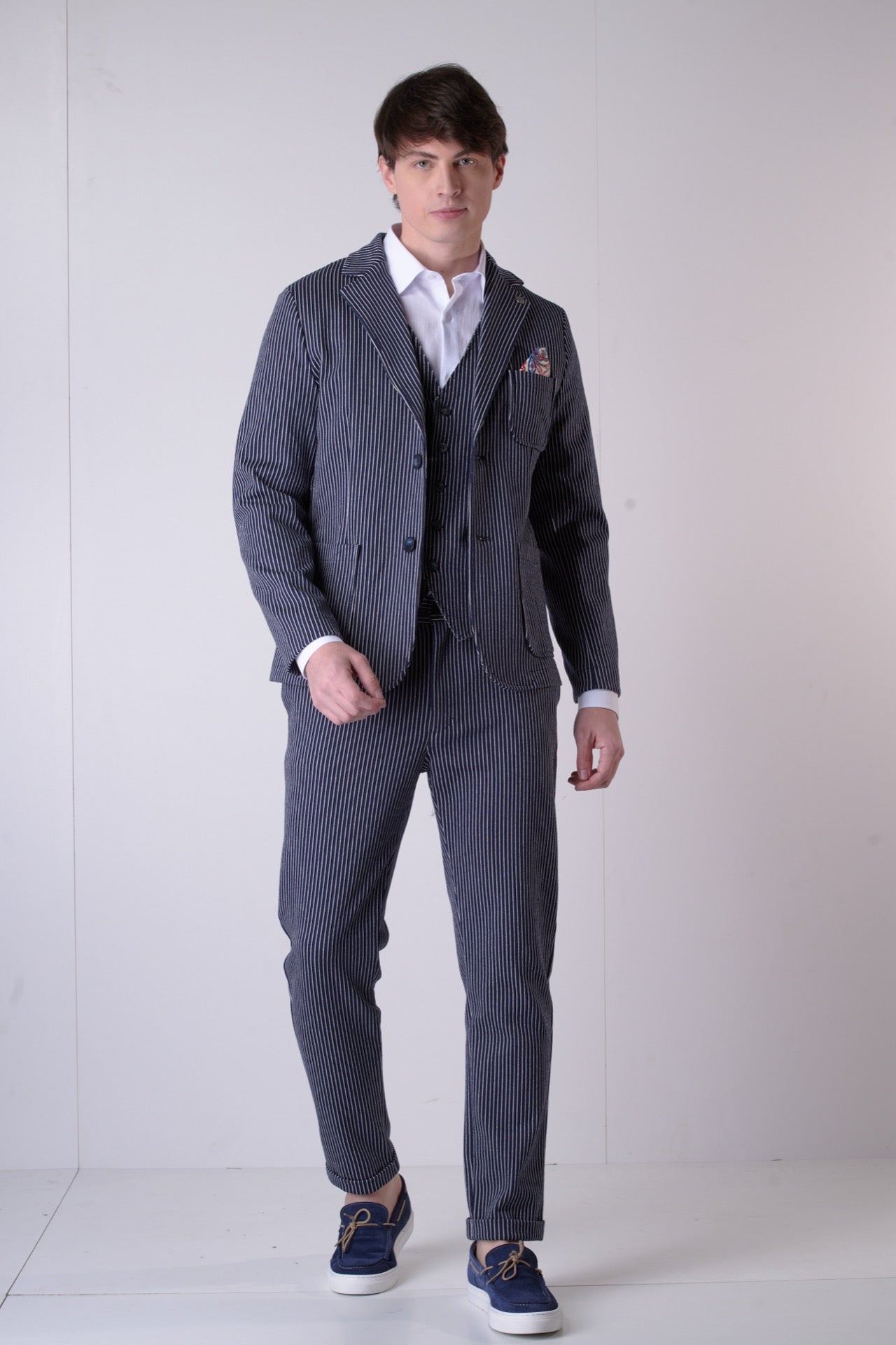 Single-breasted blue pinstripe tailored jacket with V2 fabric interior and pocket square