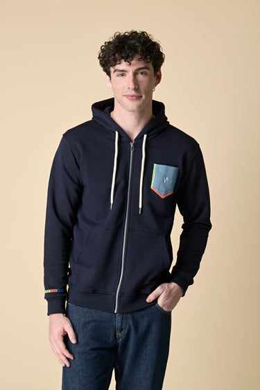 Blue zip-up hoodie with denim pocket and fluorescent embroidery