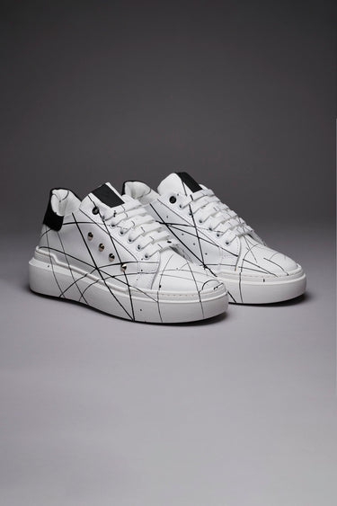 VEGA - Black back high sole sneakers with studs and paint splatters