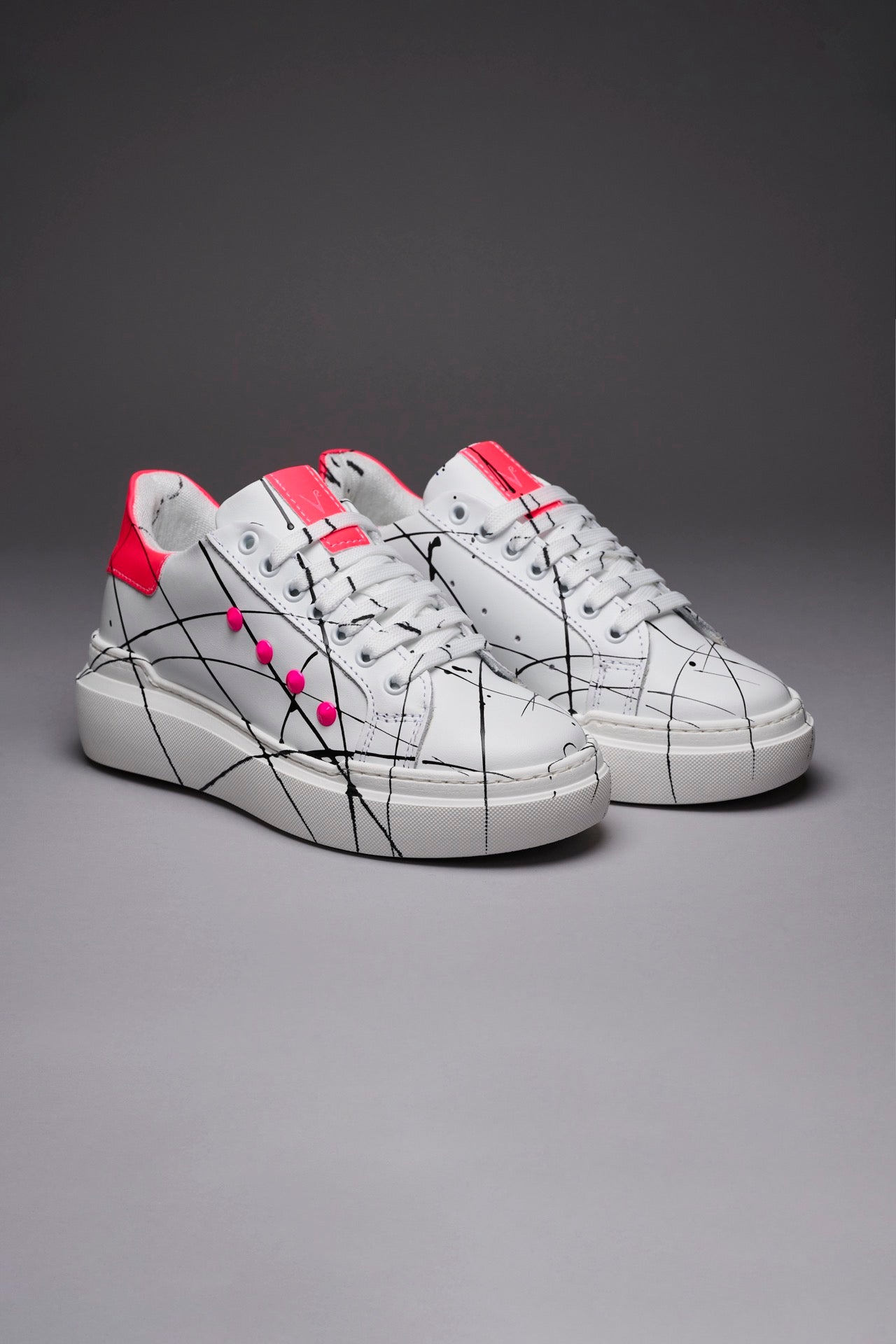 VEGA - Sneakers with retro high sole and Fluo Pink studs with splashes of paint