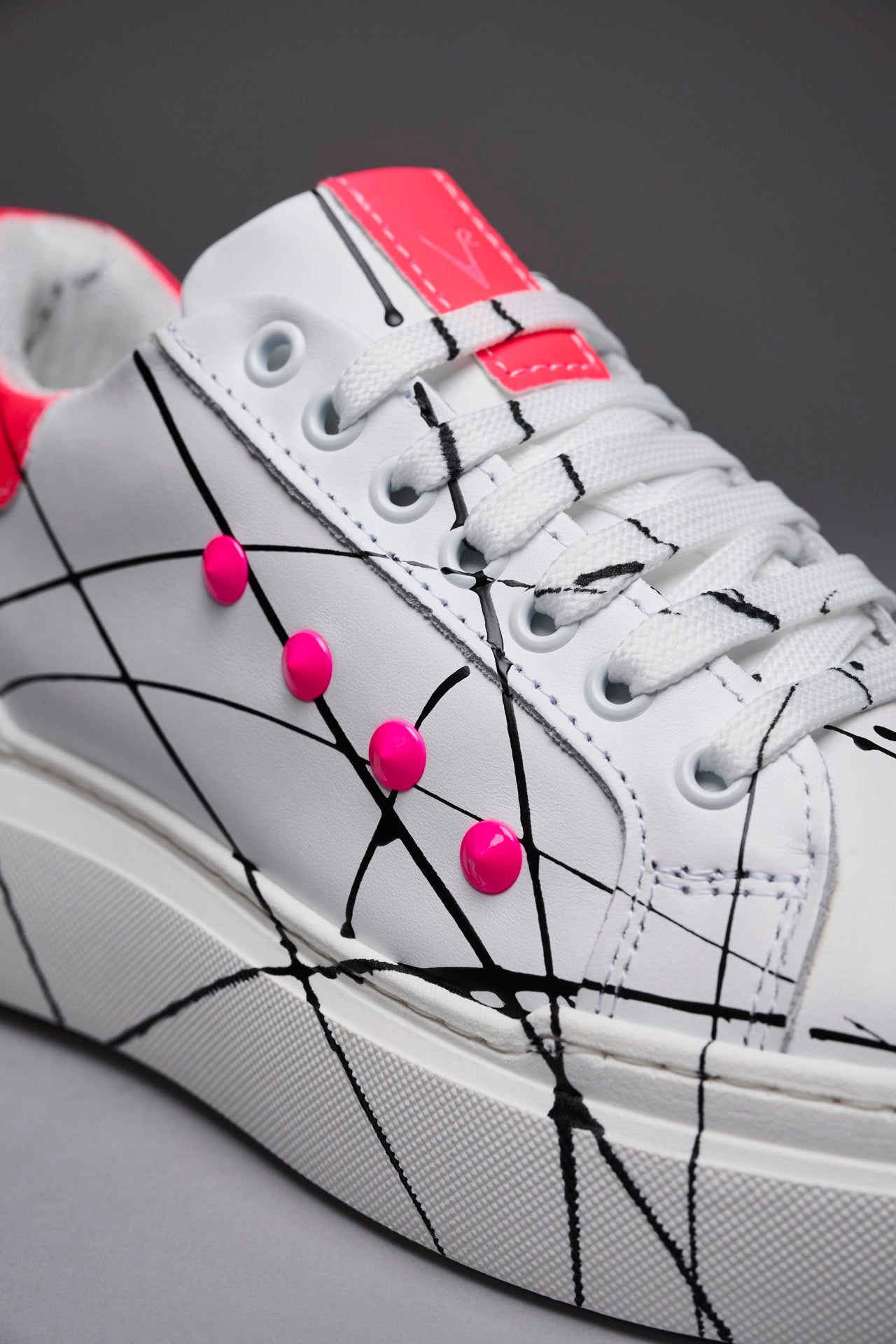 VEGA - Sneakers with retro high sole and Fluo Pink studs with splashes of paint