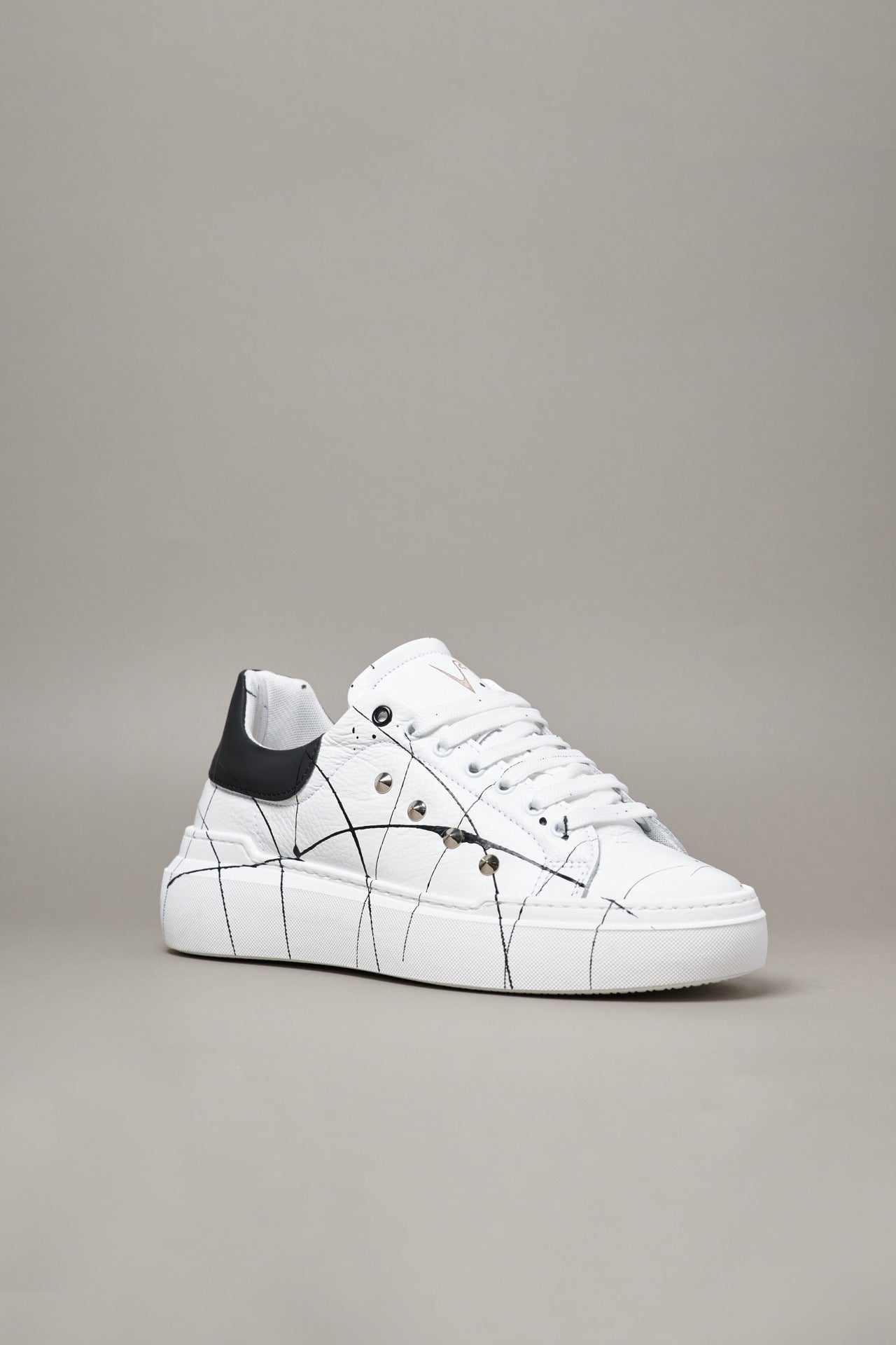 HAMMER - High sole sneakers in textured leather with Black back with studs and splashes of paint
