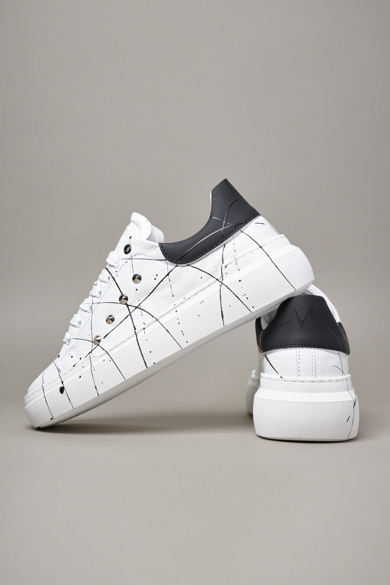HAMMER - High sole sneakers in textured leather with Black back with studs and splashes of paint