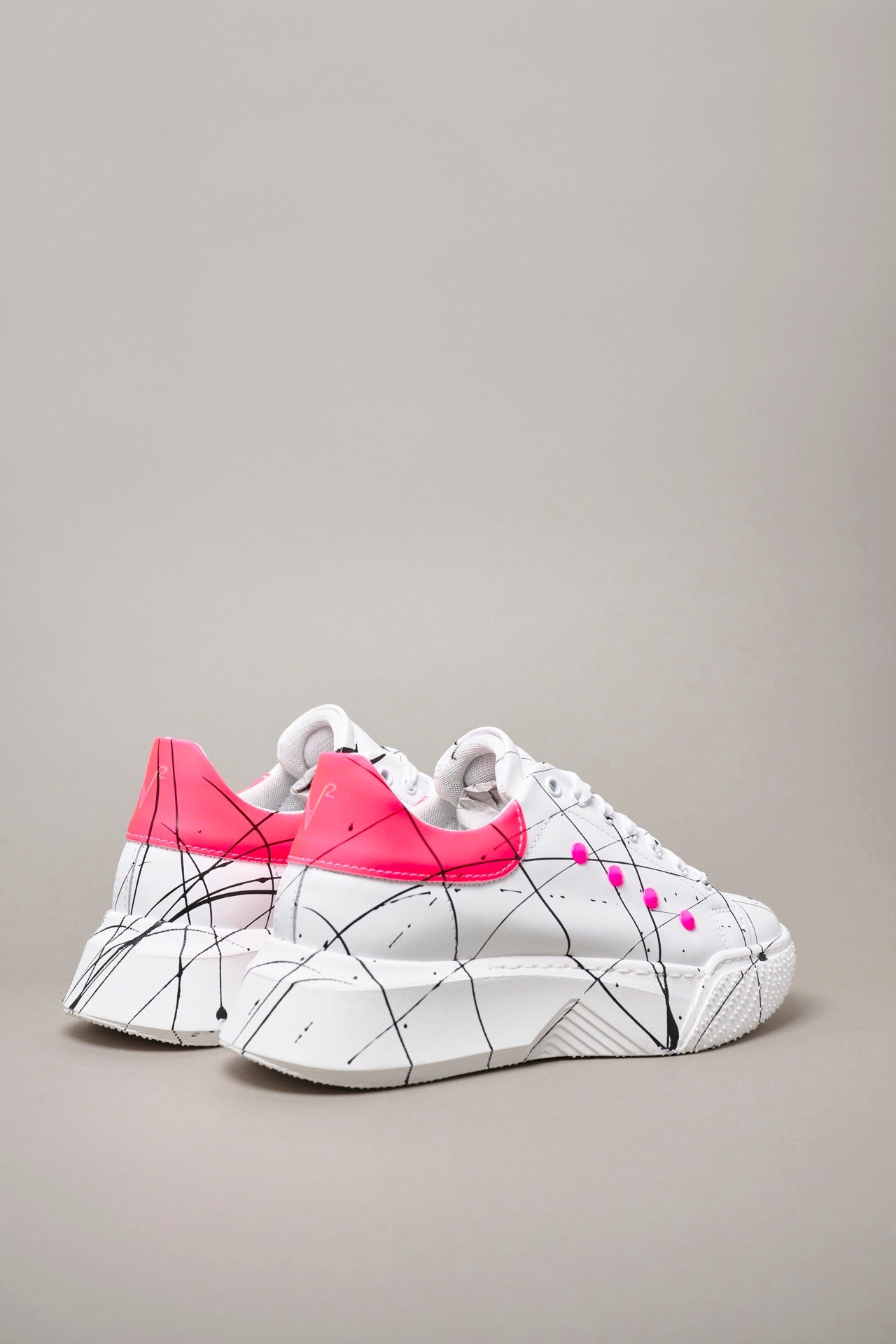 SUPERNOVA - Sneakers with retro high sole and Fluo Pink studs with splashes of paint