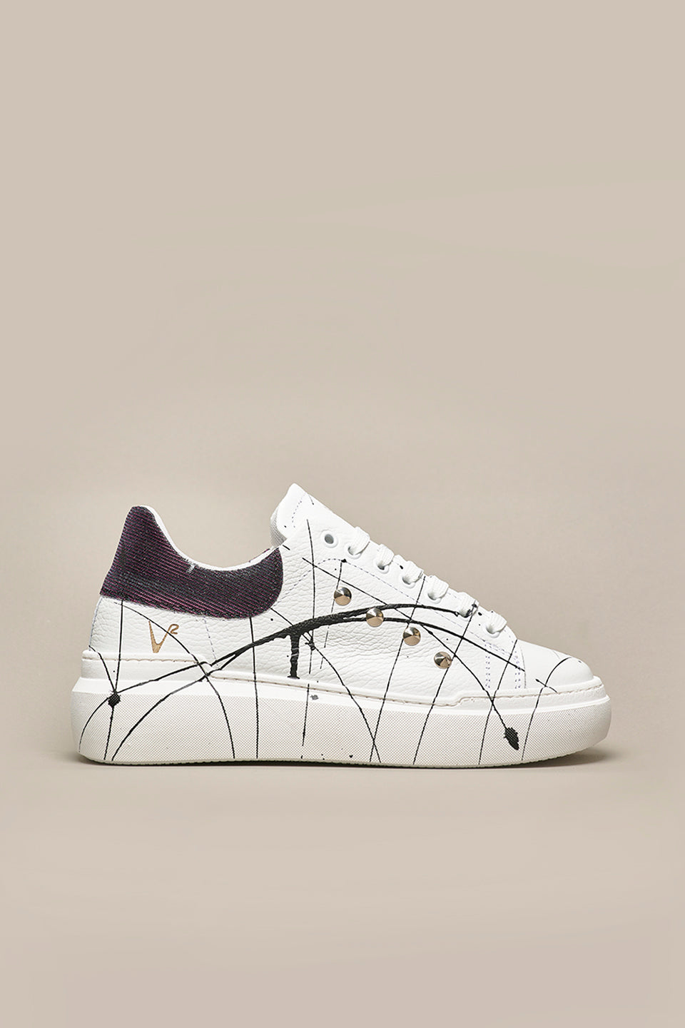 HAMMER - High sole sneakers in White textured leather with Iridescent Black back with studs and paint splashes