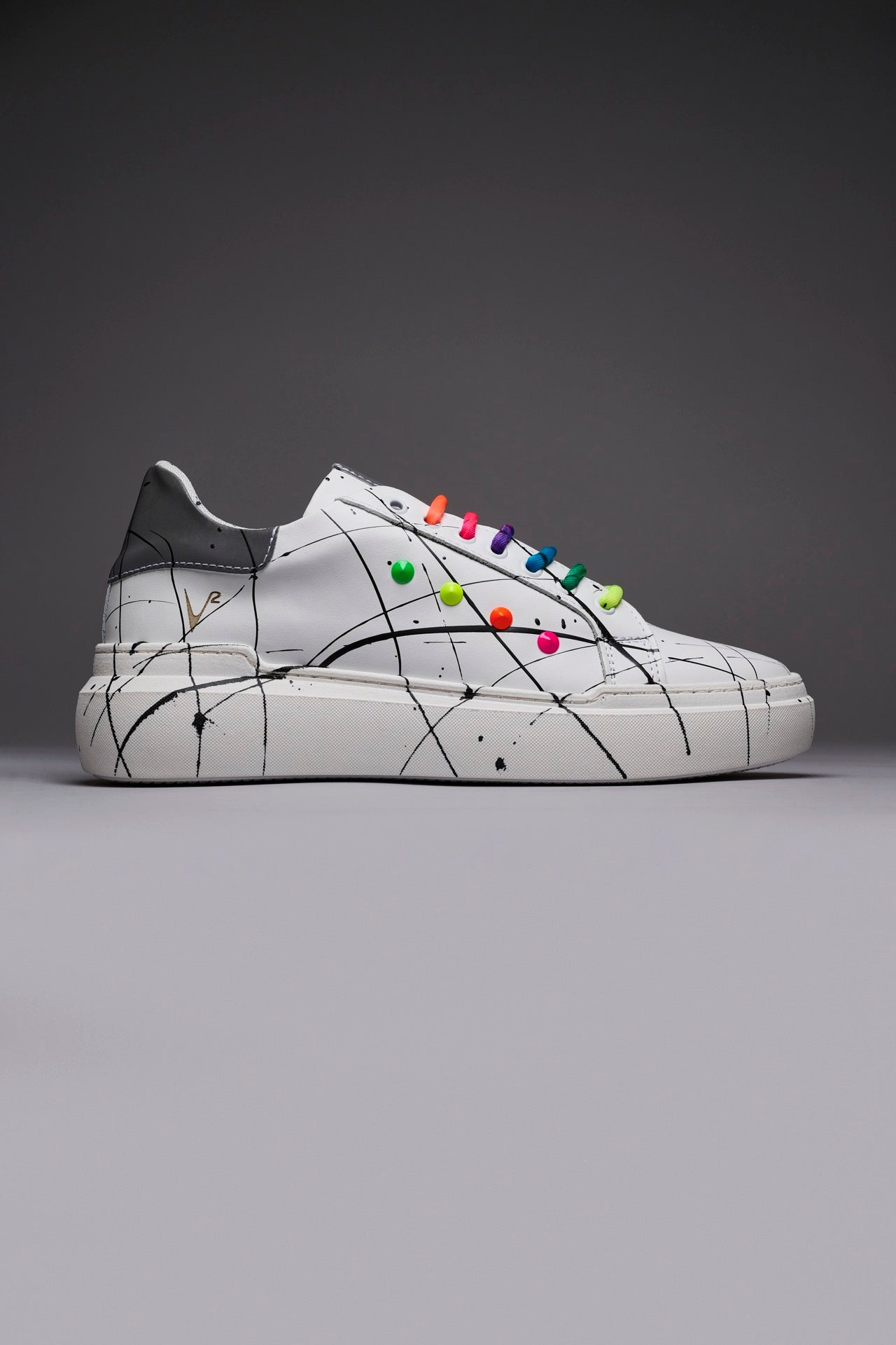 VEGA - White retro reflective high sole sneakers with multicolor laces and studs and paint splashes