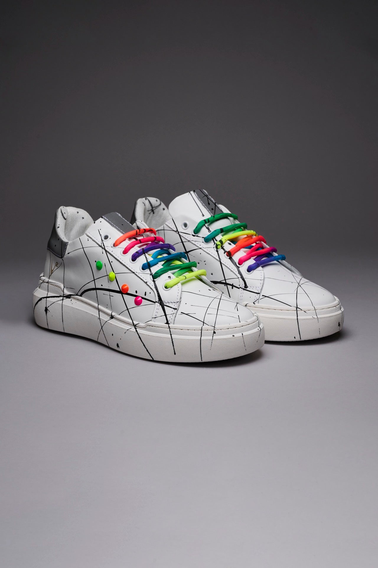 VEGA - White retro reflective high sole sneakers with multicolor laces and studs and paint splashes