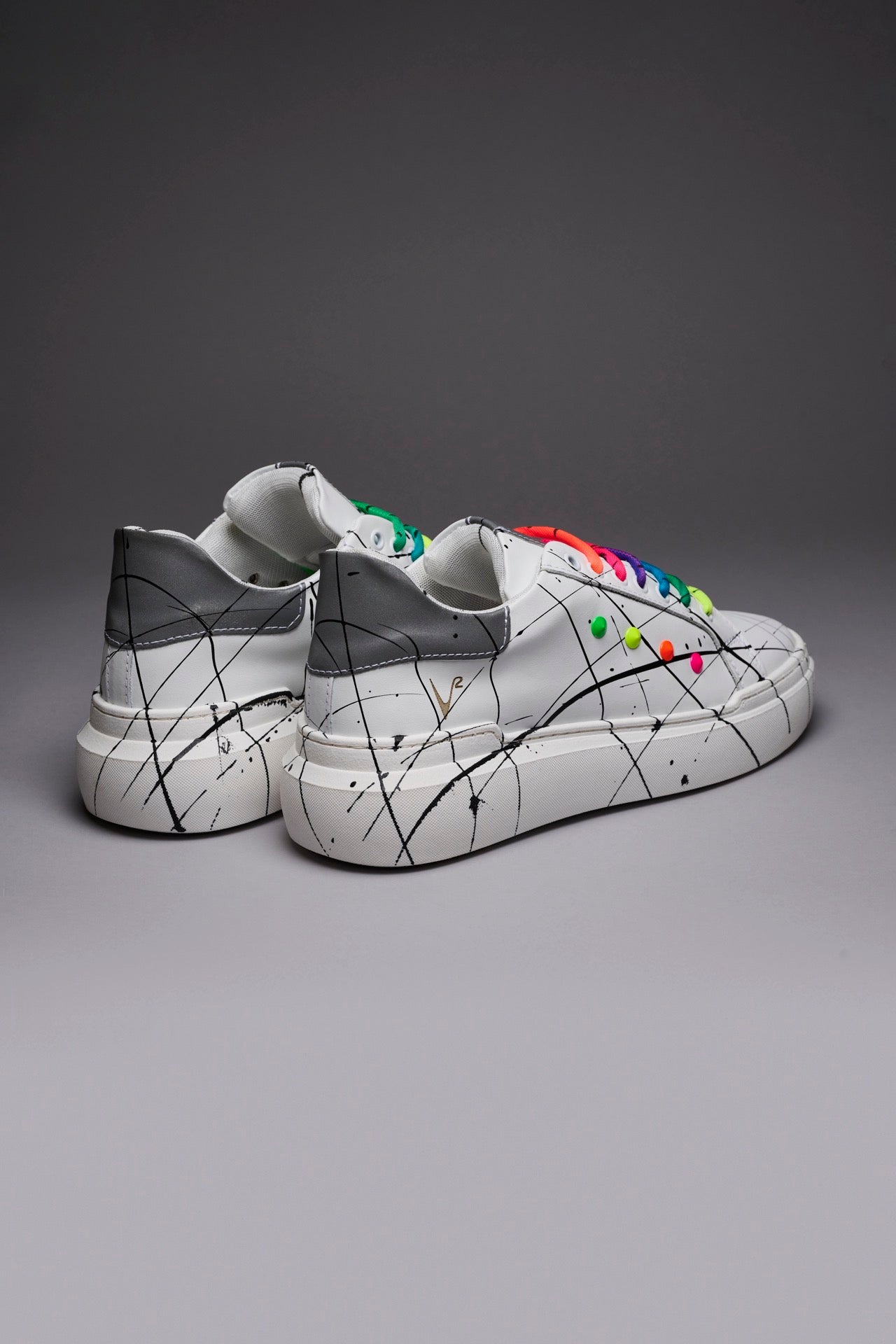 VEGA - White retro reflective high sole sneakers with multicolor laces and studs and paint splashes