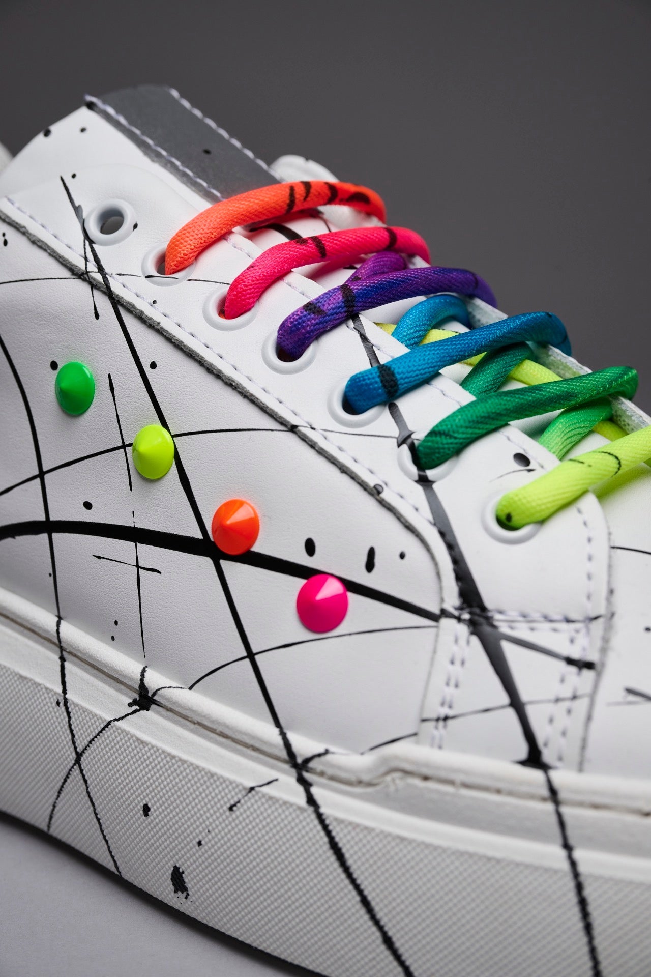 VEGA - White retro reflective high sole sneakers with multicolor laces and studs and paint splashes